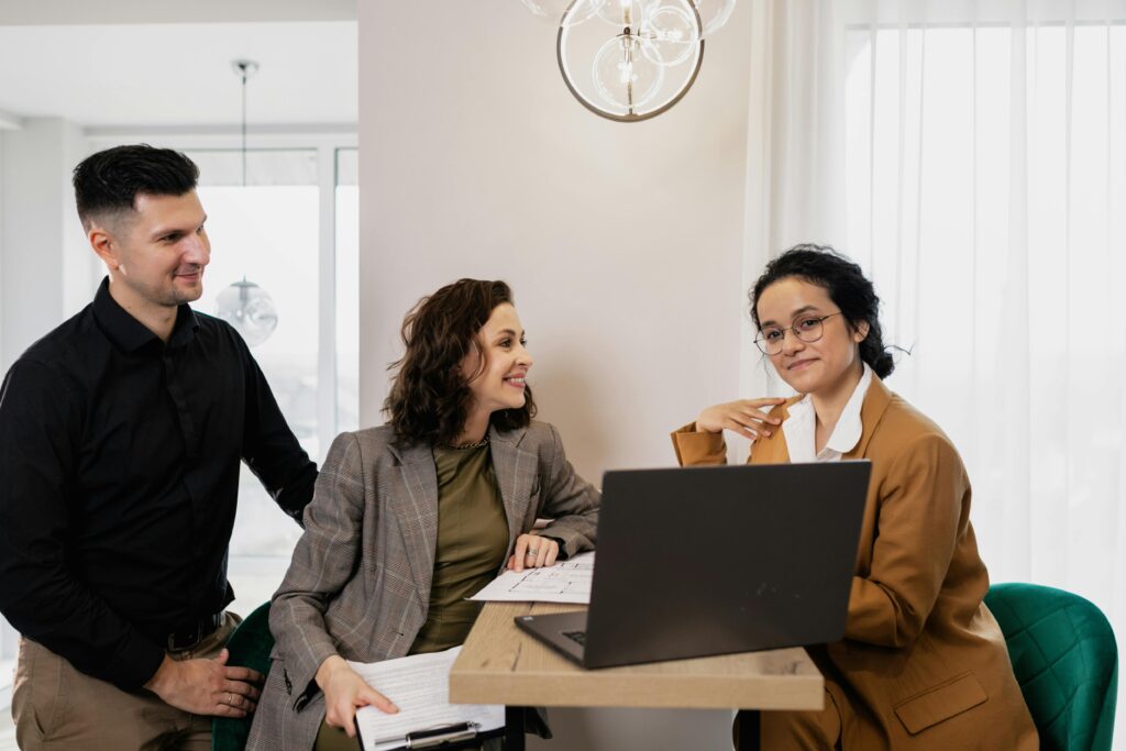 Three marketing professionals sitting down and having a meeting